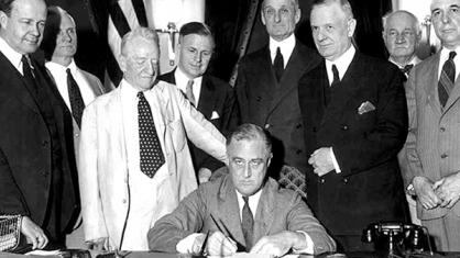 US President Franklin Rooselvelt signing the 1933 Glass-Steagall Act